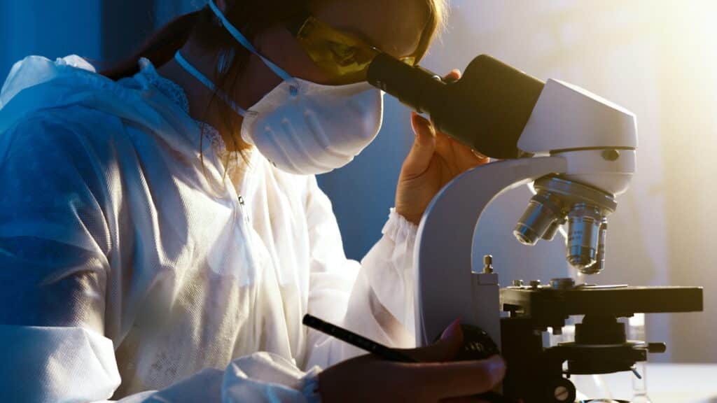 Woman over microscope